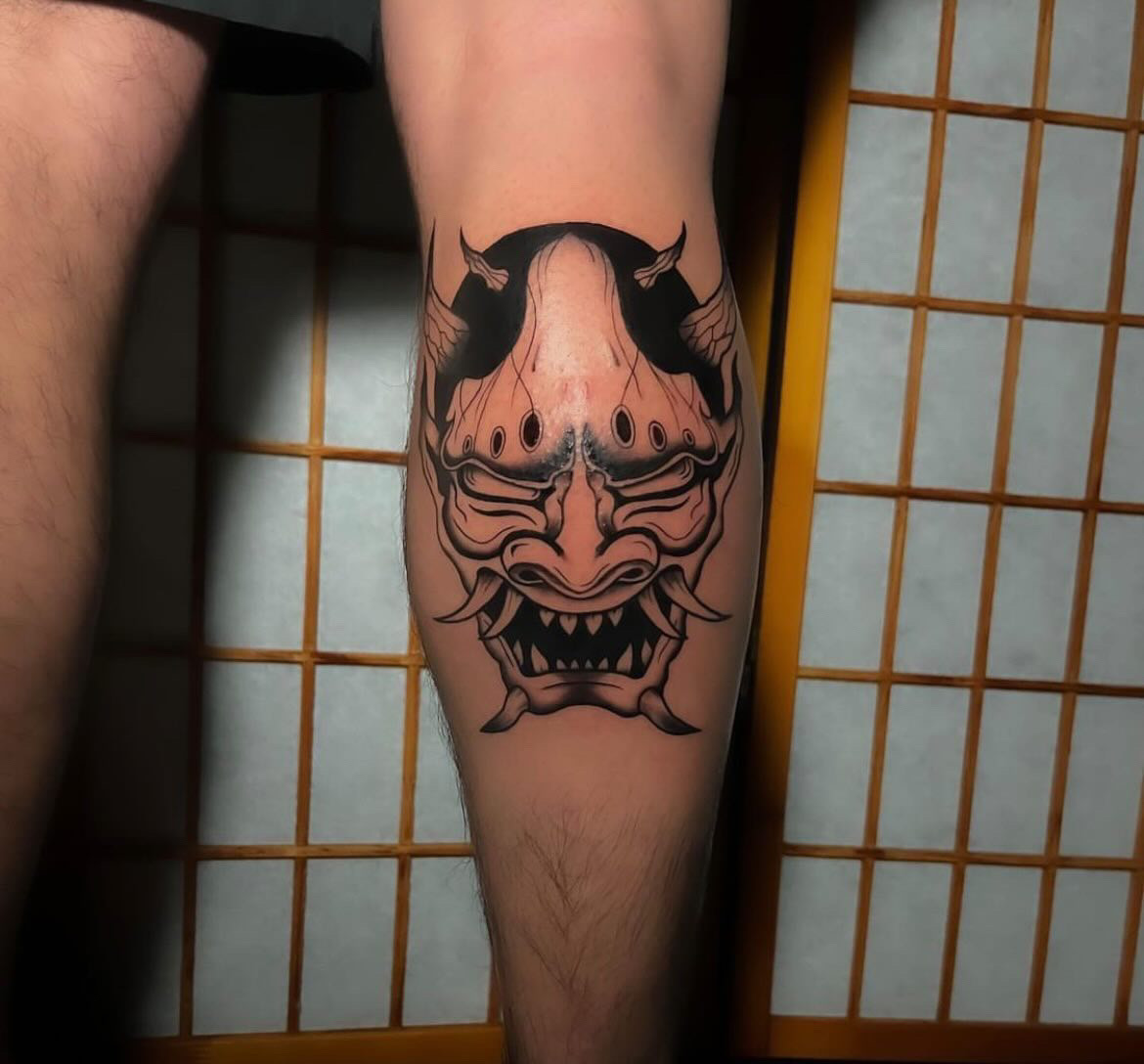 Tattoo Artist Alessandra Clivio tattoo in black and grey - demon skull calf tattoo